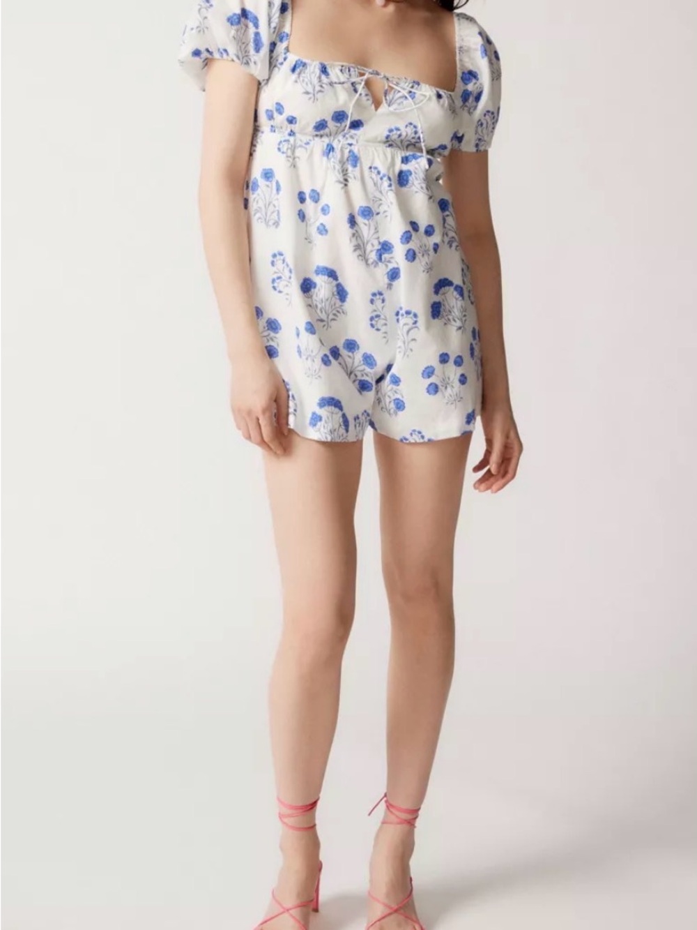 White Floral off/on the shoulder romper with blue flowers